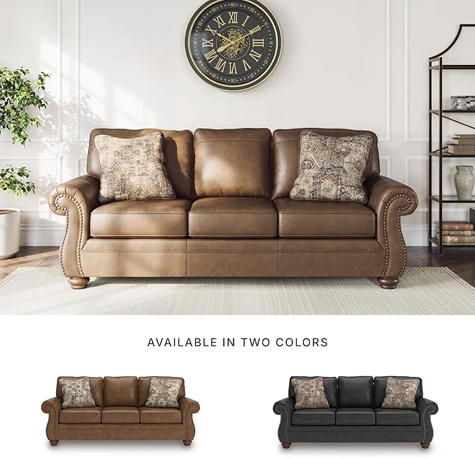 Signature Design by Ashley Shadsburne Rustic Faux Leather Sofa with Nailhead Trim and 2 Throw Pillows, Brown